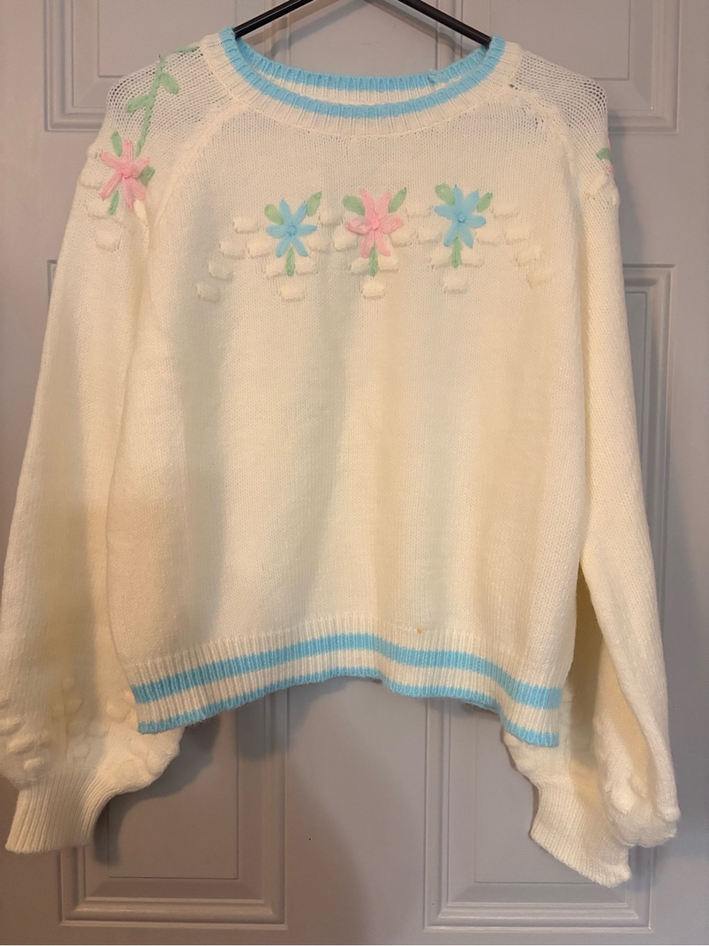 POL Cream Crewneck Sweater with Pastel Floral Appliqué and Blue Trim